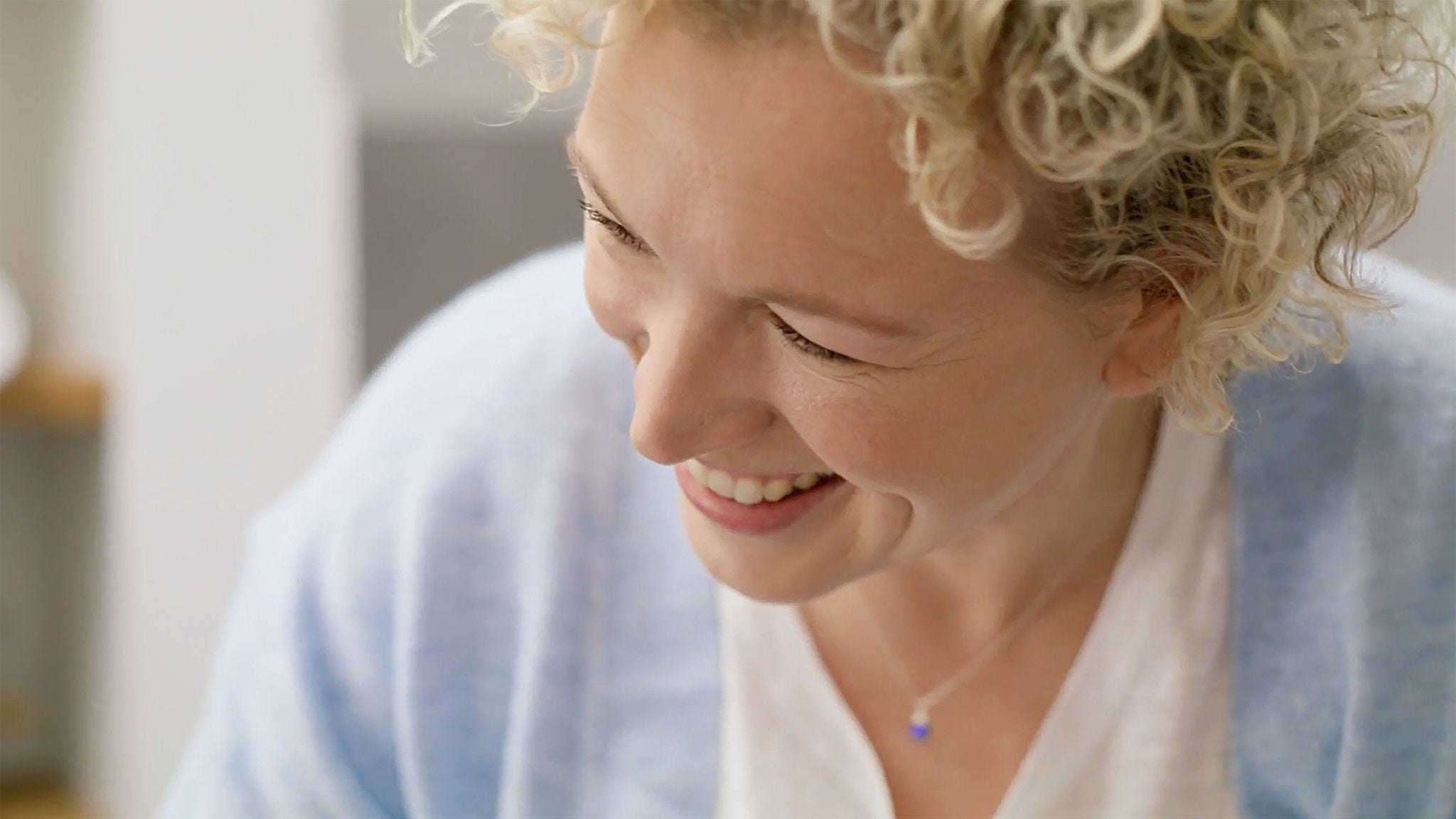 Smiling doctor speaking with a healthy and happy patient